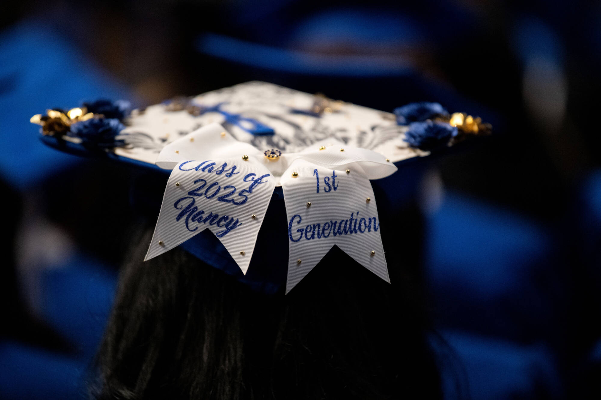 A graduation cap with a message that says 1st Generation.